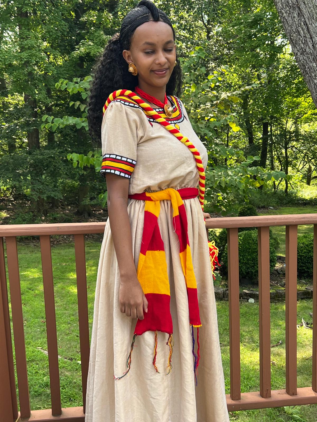 Traditional Cultural Dress with Red, Yellow, and Black Accents