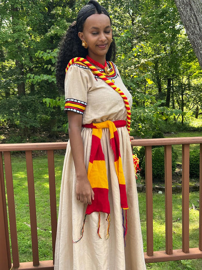 Traditional Cultural Dress with Red, Yellow, and Black Accents