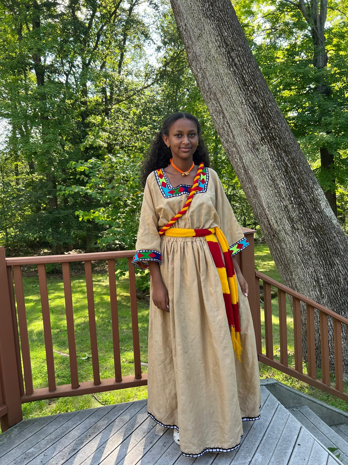 Traditional Dress in Beige with Red, Yellow, and Blue Accents