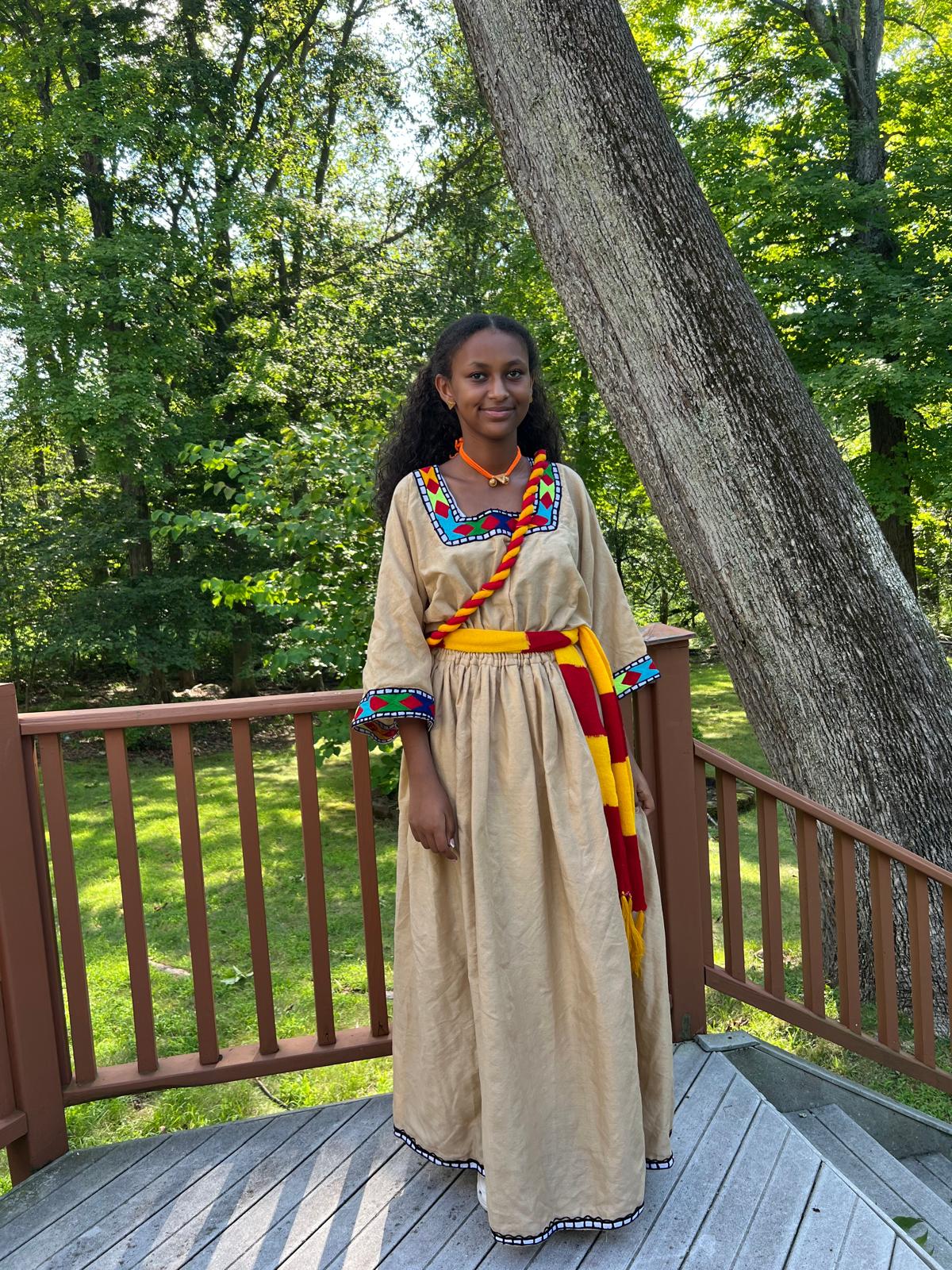 Traditional Dress in Beige with Red, Yellow, and Blue Accents