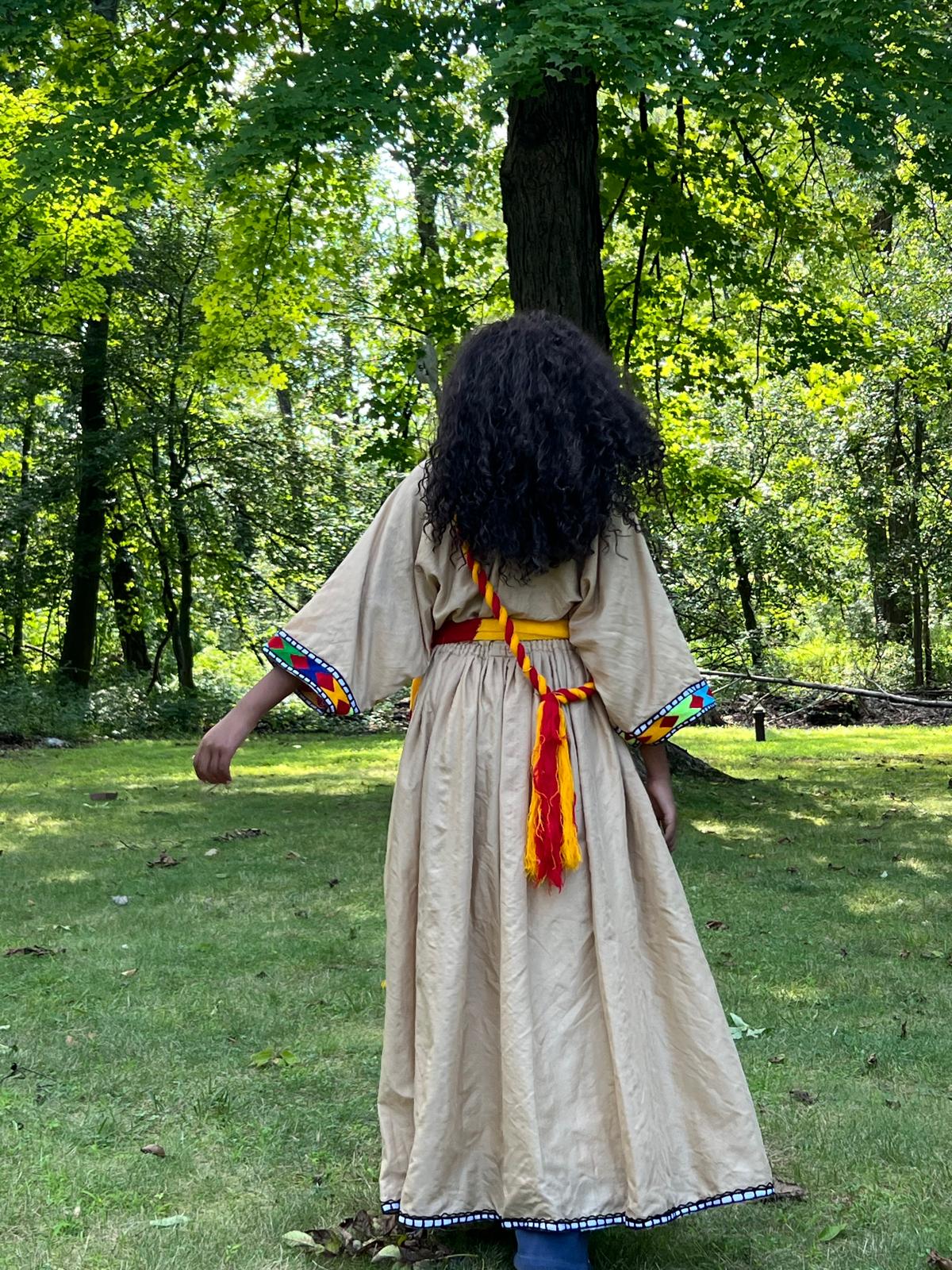 Traditional Dress in Beige with Red, Yellow, and Blue Accents