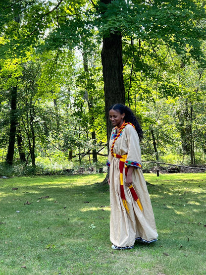 Traditional Dress in Beige with Red, Yellow, and Blue Accents